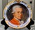 Presenting a stunning image of the famous composer Wolfgang Amadeus Mozart (1756-1791) on a decorative gilt plate. It's a...