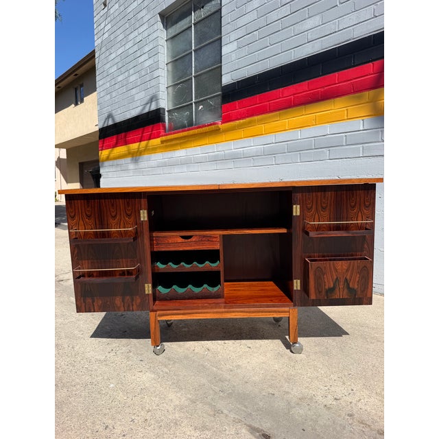 A Scandinavian Modern rosewood bar cabinet designed for Bruksbo and manufactured by Mellemstrands Trevareindustri in...