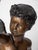 Pair of Cupids carrying a torch. The statues are heavy and detailed. The lampshades are handmade from frosted etched...