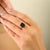 This Georgian-style solitaire ring in 18K solid yellow gold showcases a stunning 2.28-carat octagon-cut blue sapphire,...