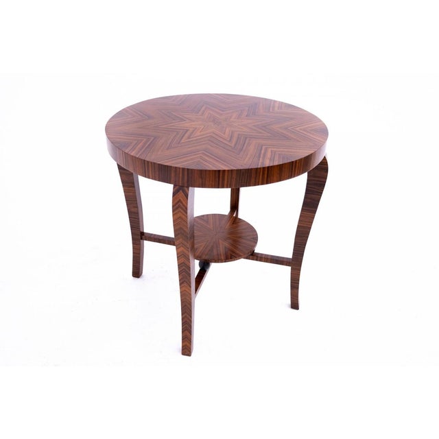 An antique table with inlaid top from around 1920, France. Table in very good condition, after professional renovation....