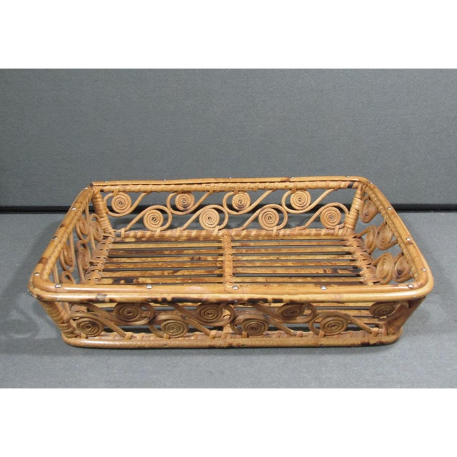 A beautifully crafted vintage handwoven rattan and bamboo tray featuring an unusually decorative repeating spiral motif....