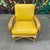 Mid Century Modern Bamboo Arm Lounge Chair. This chair features bamboo base and a yellow or gold faux leather cushion....