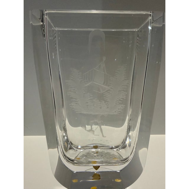 Signed Orrefors Sweden crystal vase featuring a finely wheel-engraved figural scene within a sculptural block-form body....