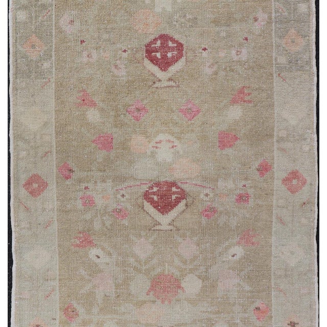 Turkish Oushak Carpet with Colorful Floral Designs Set on Sand-Green Field. Angora Turkish Oushak Carpet Antique, Keivan...