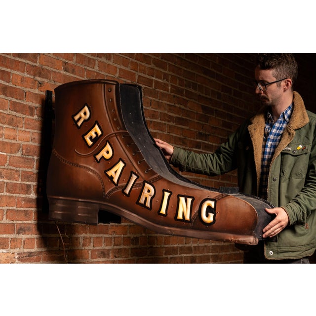 Large double-sided cobbler or shoe repair shop trade sign executed in the form of an oversized leather work boot, hand...