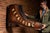 Large double-sided cobbler or shoe repair shop trade sign executed in the form of an oversized leather work boot, hand...