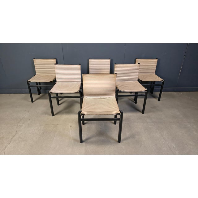 Mid century Mastro dining chairs designed by Afra & Tobia Scarpa for Molteni in the 1980s. Consisting of a black wooden...