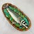 From the Mid-Century era, a Majolica glazed ceramic wall plaque showing a Fish in a Basket. Styled after an antique...