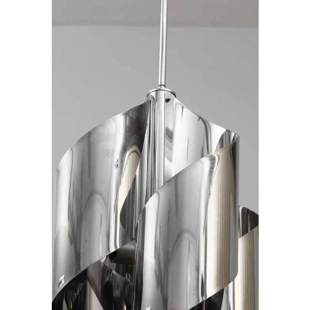 Space Age Chromed Chandelier, 1970s, in Flawless conditions. Designed 1970 to 1979 This piece is designed in the style of...