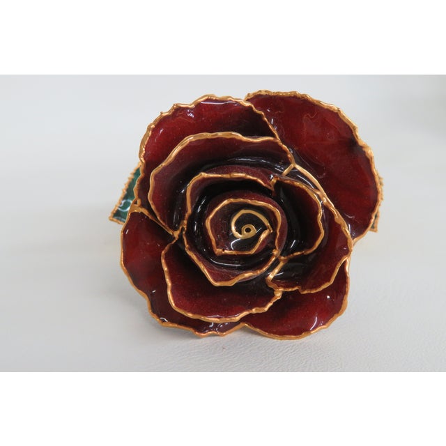 This gorgeous rose is 24-karat gold dipped rose with red petals and green leaves lacquer, it would make a magnificent and...