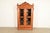 An exceptional antique Victorian or Renaissance Revival bookcase or display cabinet In the manner of R.J. Horner & Co....