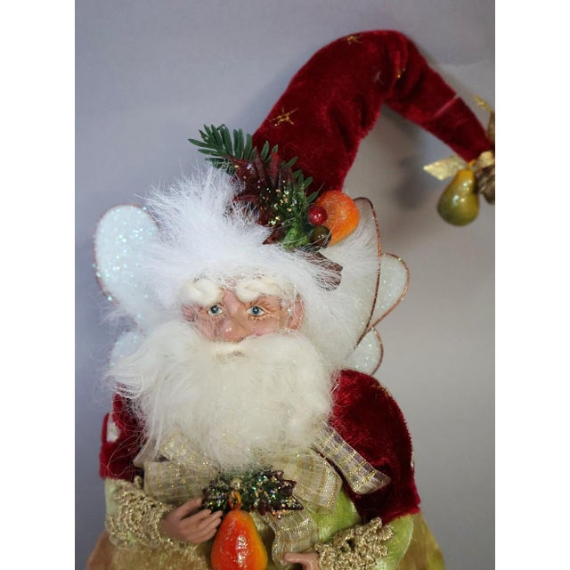 A whimsical vintage Mark Roberts Christmas fairy, circa 2000s, dressed in rich red, chartreuse and gold velvet with...