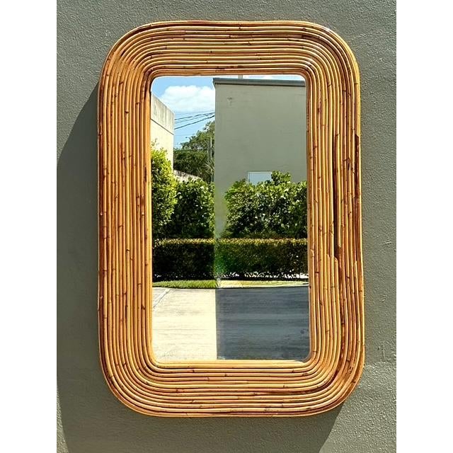 This stunning large wall mirror is a masterpiece of 1970s Organic Modernism, bearing the prestigious Gabriella Crespi...