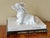 Whimsical matte white basset hound figure with ears blowing in the wind. Crafted in the early 21st century. Most items...