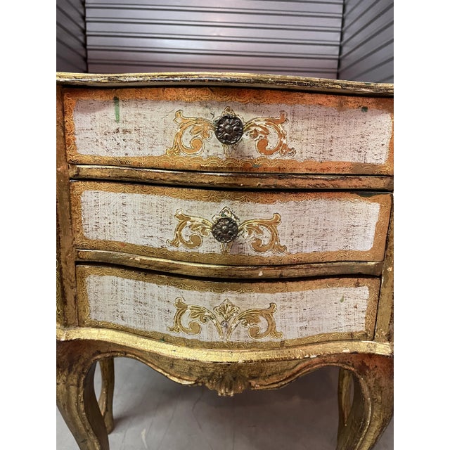 A pair of Italian Florentine nightstands in gilt wood.