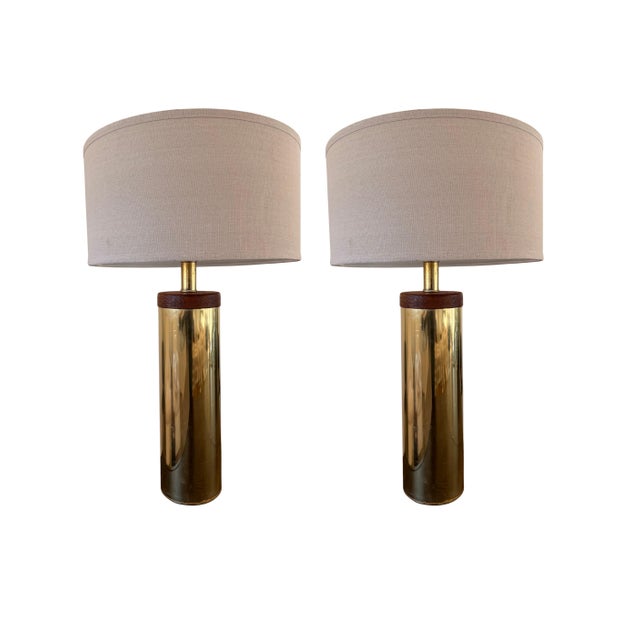 Pair of Mid -Century Brass and Wood Cylinder Lamps attributed to Laurel, likely from the 1960's-1970's. They have a sleek,...