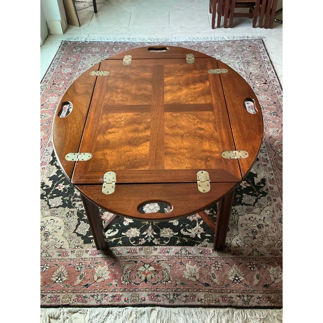 This classic vintage butler’s tray table brings warmth and traditional charm to any space. Crafted from richly grained...