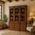 A 1960s Drexel Triune hutch cabinet in mahogany, combining a broad three-bay display section with enclosed lower storage....