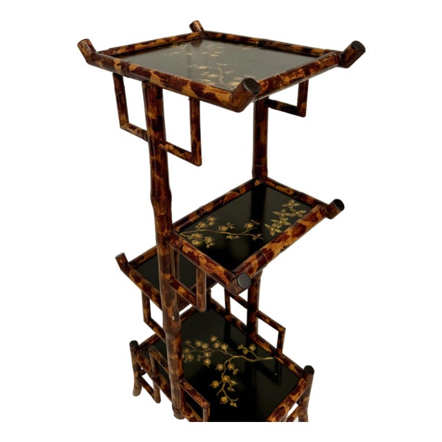 Here is a stunning, bamboo tiered display shelf/stand that features a faux tortoise shell finish, black lacquer and hand-...