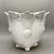 • Unmarked ornate footed jardiniere planter with raised floral, foliate and scrollwork decoration. • Vintage design with...