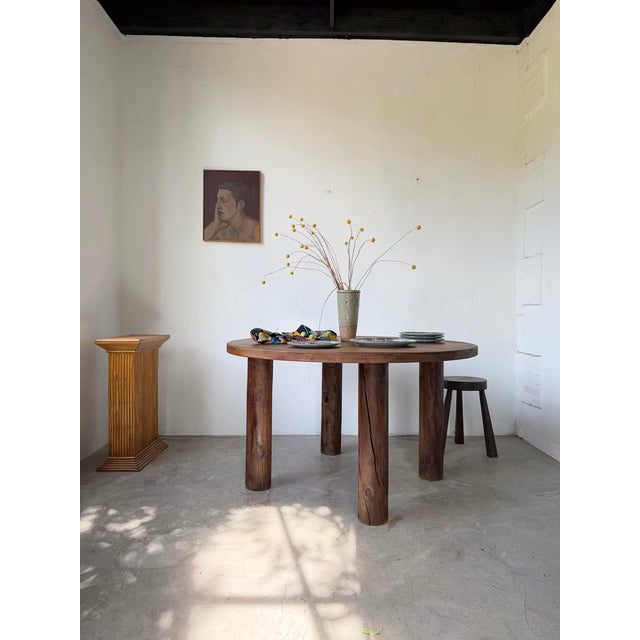 Antique round dining table with four solid round legs. We love the overall 1950s look, with its elegant and timeless...