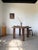Antique round dining table with four solid round legs. We love the overall 1950s look, with its elegant and timeless...