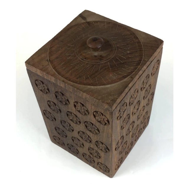 Heavy wood box with intricate carving all around each side and on the lid. Made from a single piece of wood and using the...