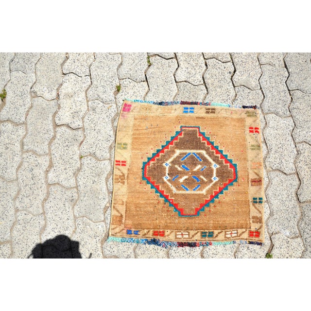 This is a vintage Turkish Oushak rug from the 1960s. The piece was hand-knotted.