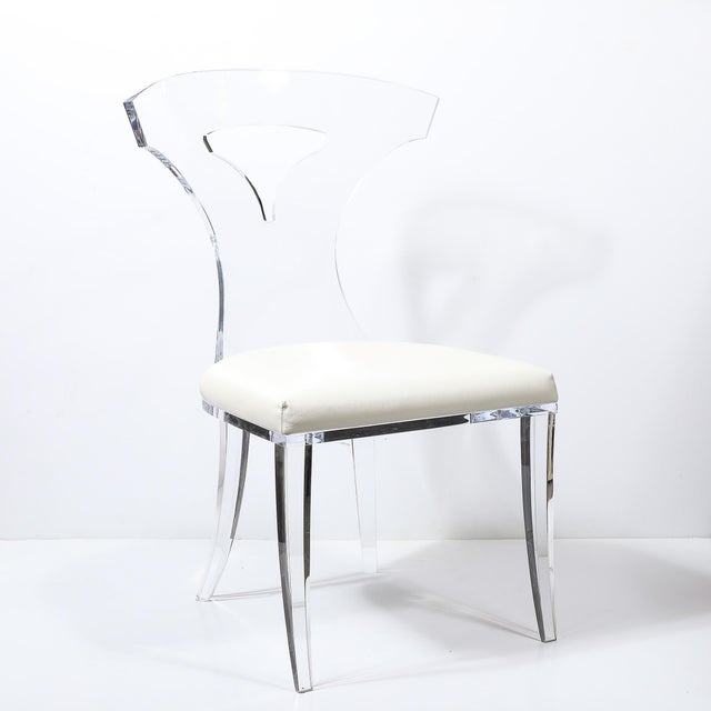 This Mid-Century Modernist Klismos Lucite Chair W/White Leather Upholstery originates from the United States during the...