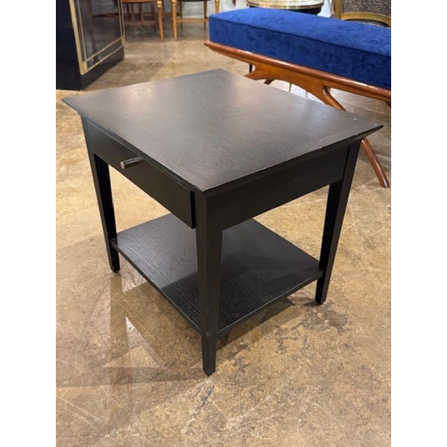 The 19th Century Black Biedermeier Side Table is a stylish and elegant piece of furniture for the home. The sleek black...