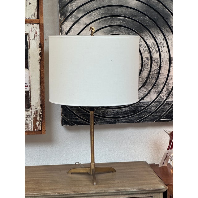 Design Plus Gallery presents a Brass Table Lamp with Decorative Top Finial. This vintage table lamp has a brass-tone metal...