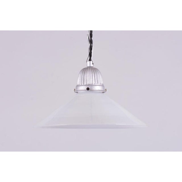 This pendant chandelier, originating from the 1970s Czechoslovak design environment, represents a typical example of the...