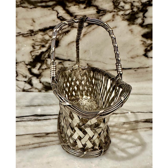 French style vintage high quality silver hand weaved wicker style wine bottle holder. No maker’s marks.