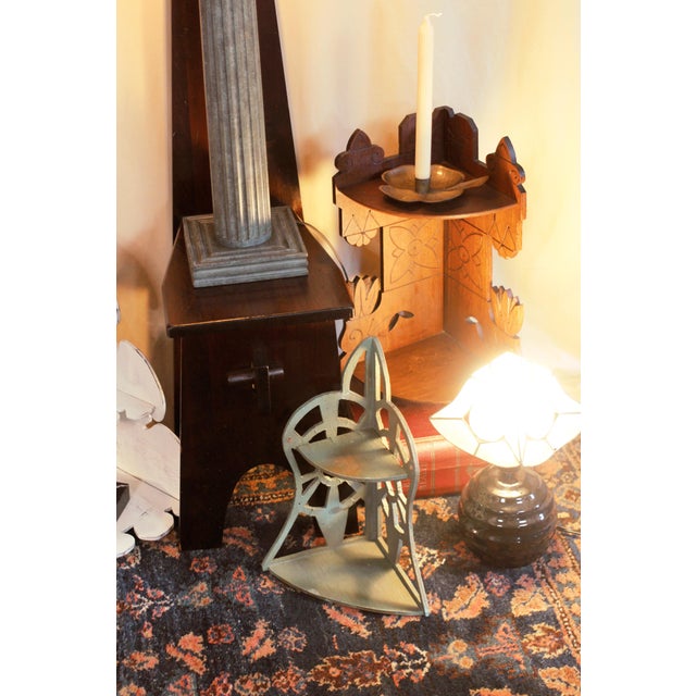 A wooden corner shelf with 2 shelves with scroll cut edges and cutouts. Folk or rustic style handmade in the 1920s-30s....