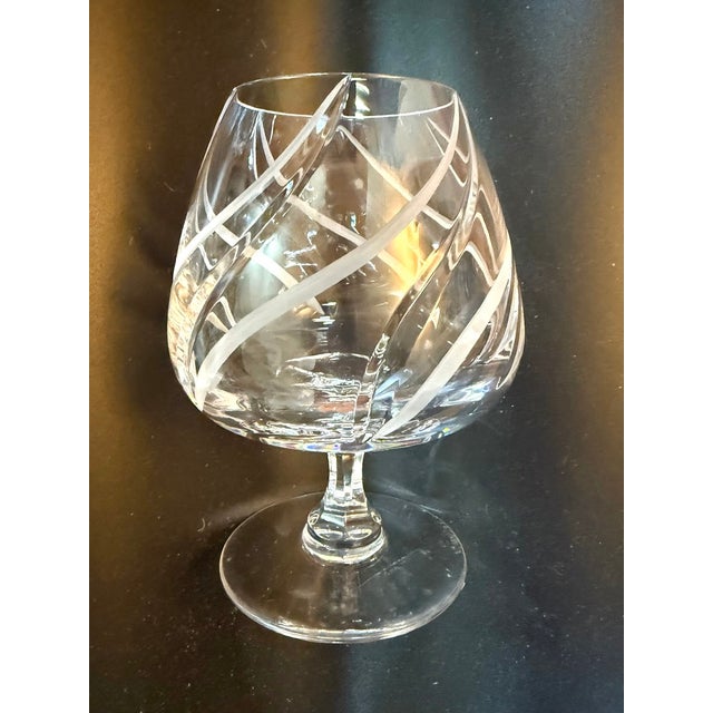 Elevate your sipping experience with these elegant Mikasa “Windlass” brandy snifters, featuring a graceful swirl-cut...