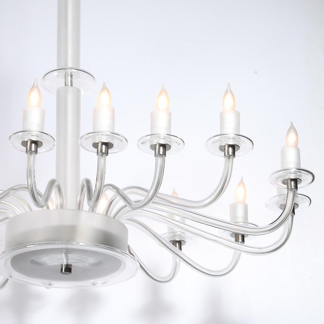 This Mid-Century Modernist 16-arm chandelier, rendered in hand-blown and frosted and clear Murano glass, is a stunning...