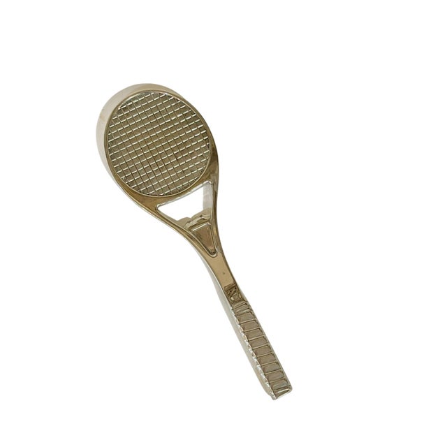 Vintage tennis racquet shape bottle opener. Charming and playful silver plate made by Perrier in the 1980’s. Perfect fun...