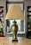 Striking brass urn lamp with wood felted base. Heavy living brass of remarkable craftsmanship and imposing stature at 33...
