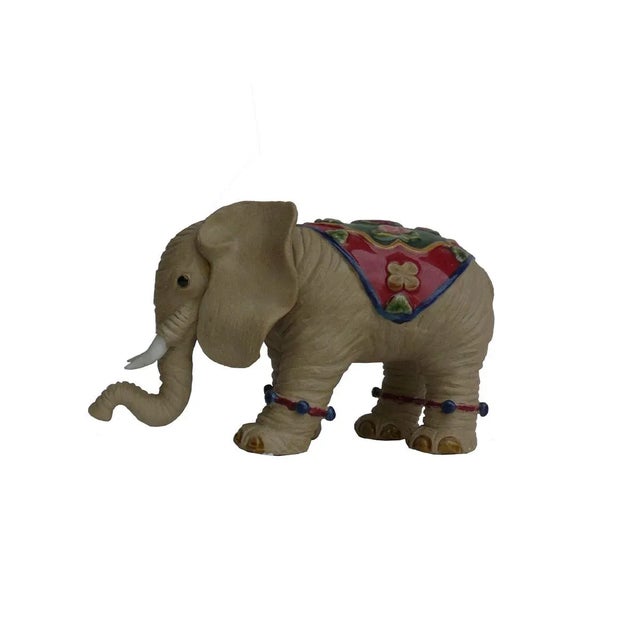 Handmade pair of ceramic elephant figure statues with plain color and charm accent on the body. Unique with character,...