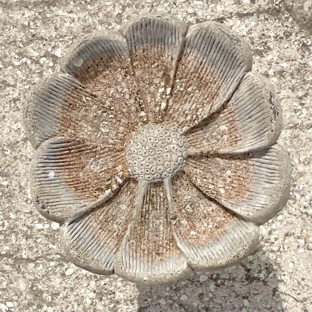 A fantastic vintage Coastal bird bath. Done in a cast concrete with a charming flower design. Acquired from a Palm Beach...