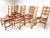 Set of ten dining chairs by Henning Kjaernulf for Nyrup Mobelfabrik. Sculpted solid Oak frames have a warm rustic and...