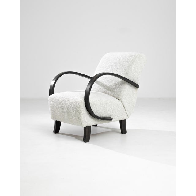 This 1930s Czech Wooden Armchair by J. Halabala is a striking example of early 20th-century modernist design, blending...