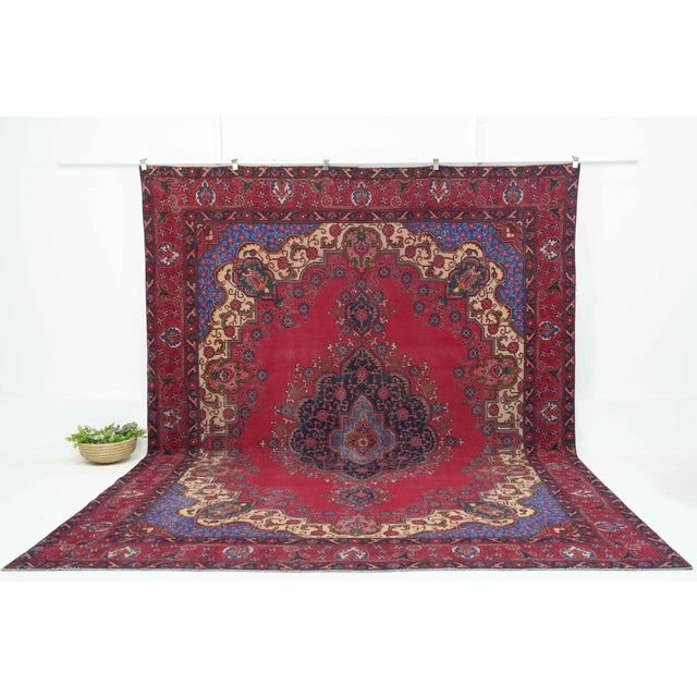 This vintage Persian Hand-Knotted area rug is a semi-antique vintage area rug. The '70s Eastern region of Persia's unique...