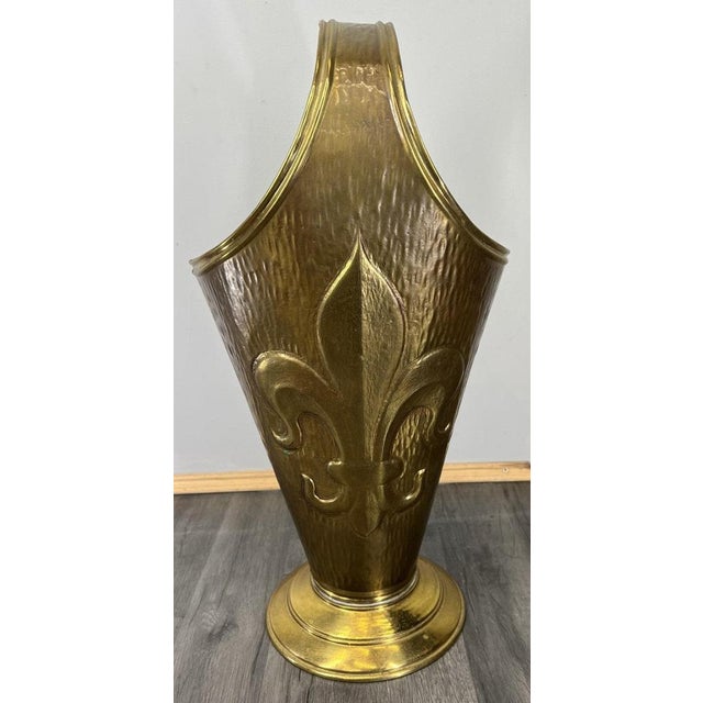 This Vintage French brass umbrella stand is an elegant and sculptural hallway piece, featuring a tall flared form with...