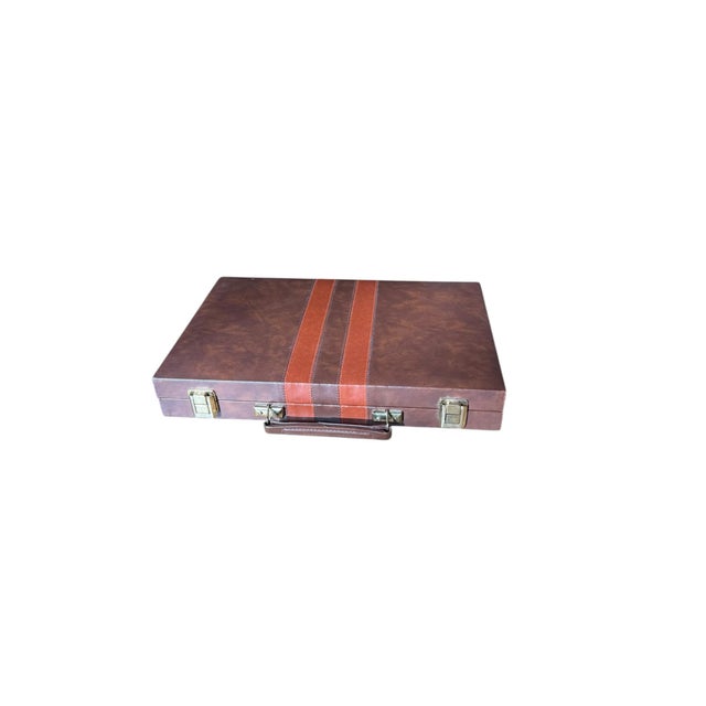 Offered for sale is a vintage Backgammon Set in a brown and orange leatherette handled case . This complete set includes:...