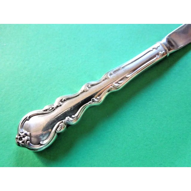 Offered is a beautiful master butter knife in the midcentury Angelique pattern made by International Sterling. Designed...