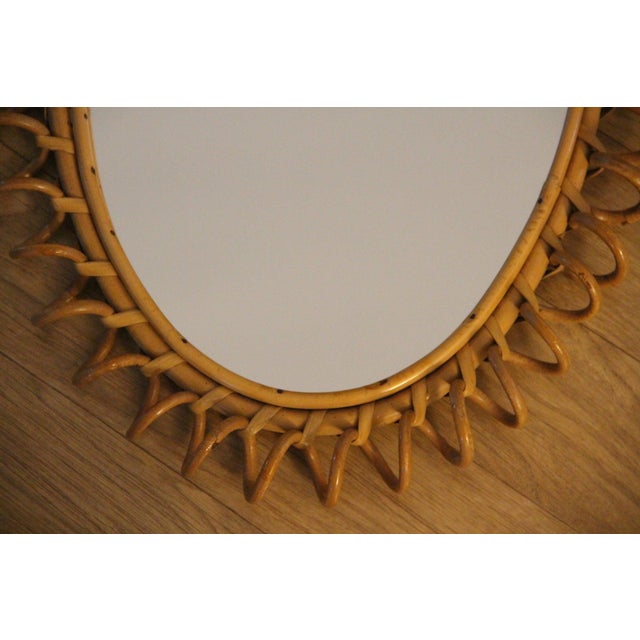This highly decorative mirror was made in Italy in the 1960s. It is typical of the design of that period and is entirely...
