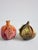 Set of two Arte Italica Italian hand made sculptural ceramic decorative fruits for table top. The 1st one represent a half...