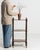 A 19th century English étagère in the Victorian style, constructed in wood with a three-tier shelving arrangement. The...